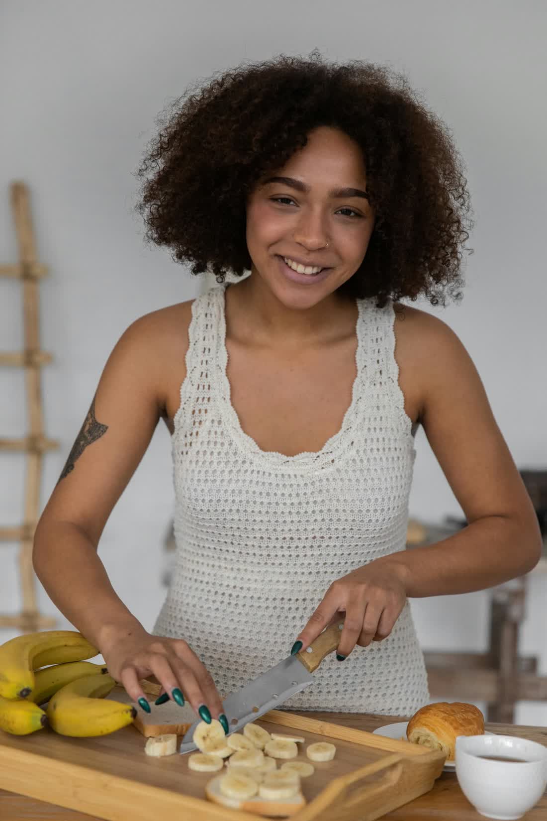 A Mayz host preparing food in her kitchen